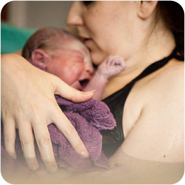 New born held by his mom